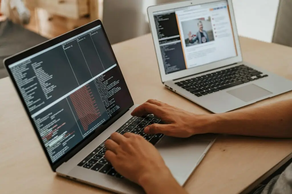 a person typing on a laptop